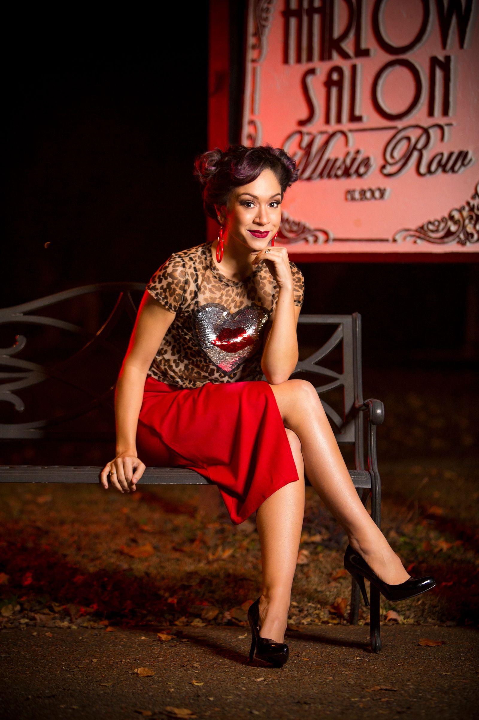 Pin-up styled client outside the Harlow Salon Music Row sign